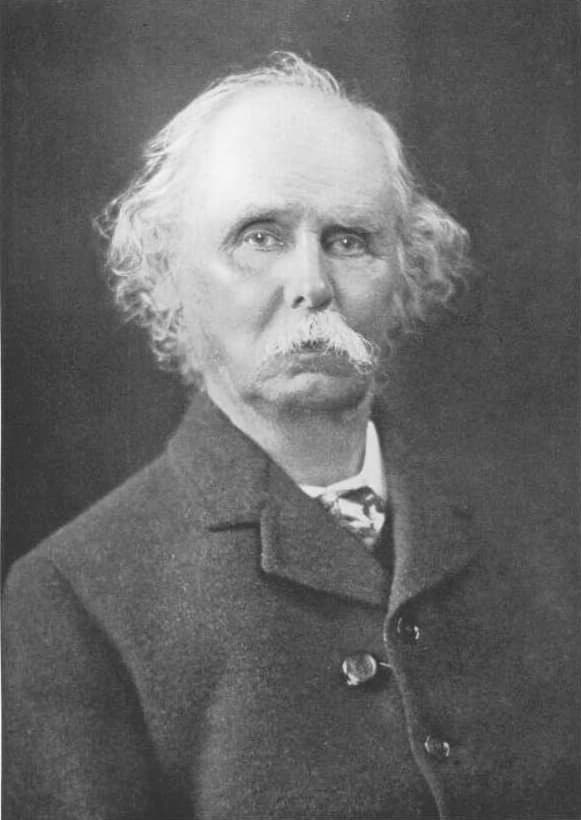 Black-and-white portrait of the economist Alfred Marshall, an elderly man with a white moustache.