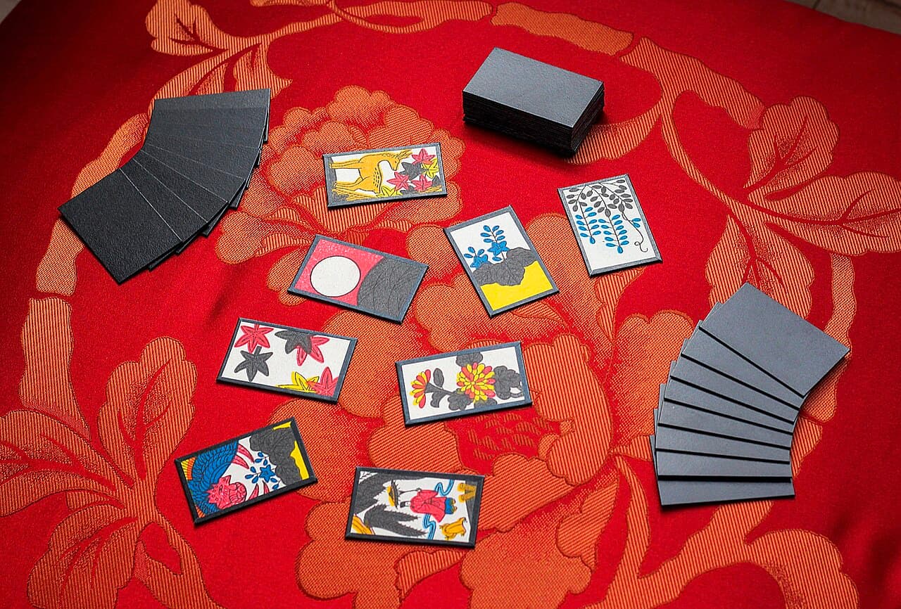 A set of hanafuda playing cards laid out for a game of Koi-Koi.