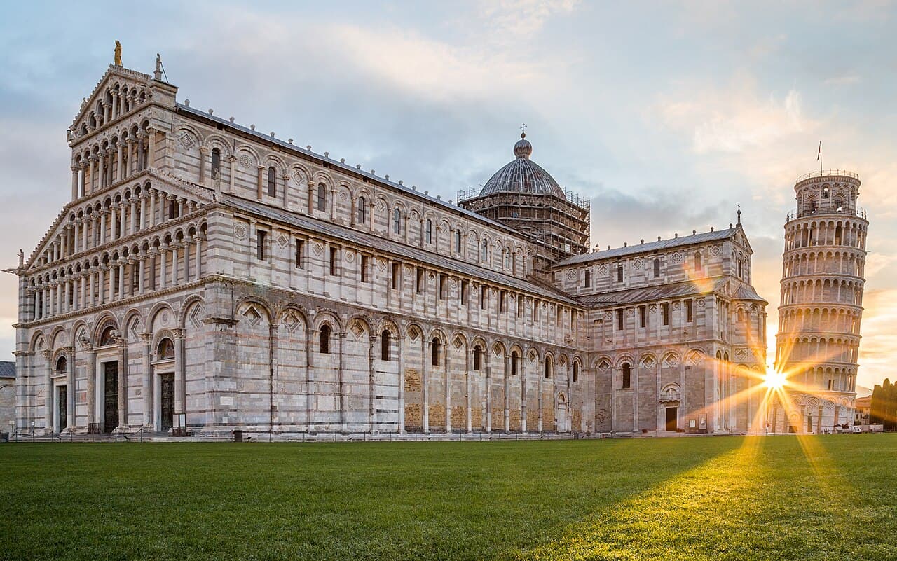 The Leaning Tower of Pisa and the Pisa Cathedral at sunrise.