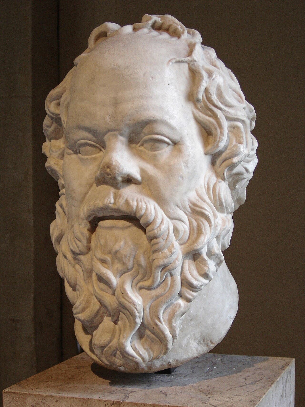 Marble bust of the Greek philosopher Socrates, bearded and balding.