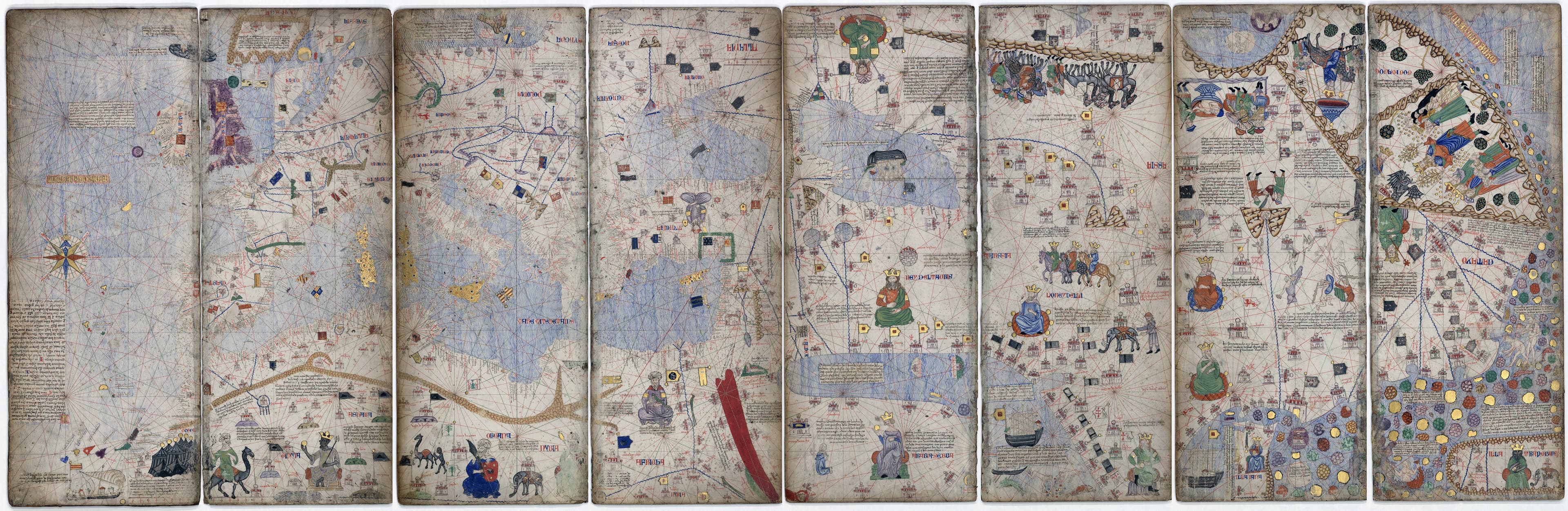A medieval illuminated map on vellum, the Catalan Atlas, showing coastlines, flags, and illustrated figures in gold and colour.