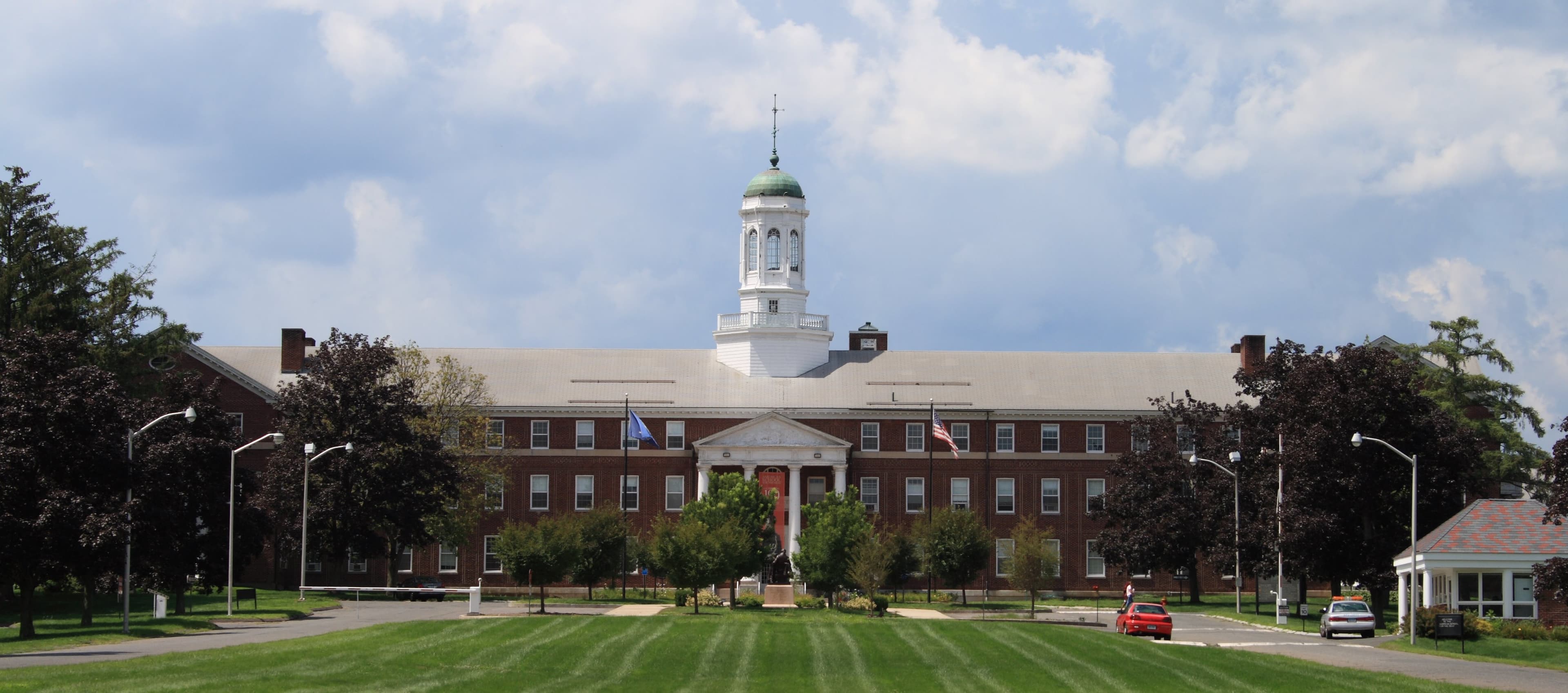 Photograph of the main building of the American School for the Deaf, a large brick building with white columns.