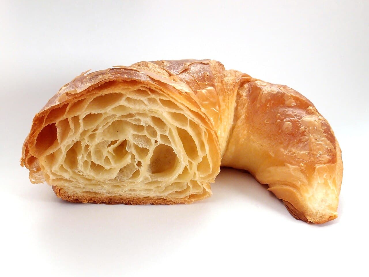 Cross section of a croissant showing thin, airy layers of dough