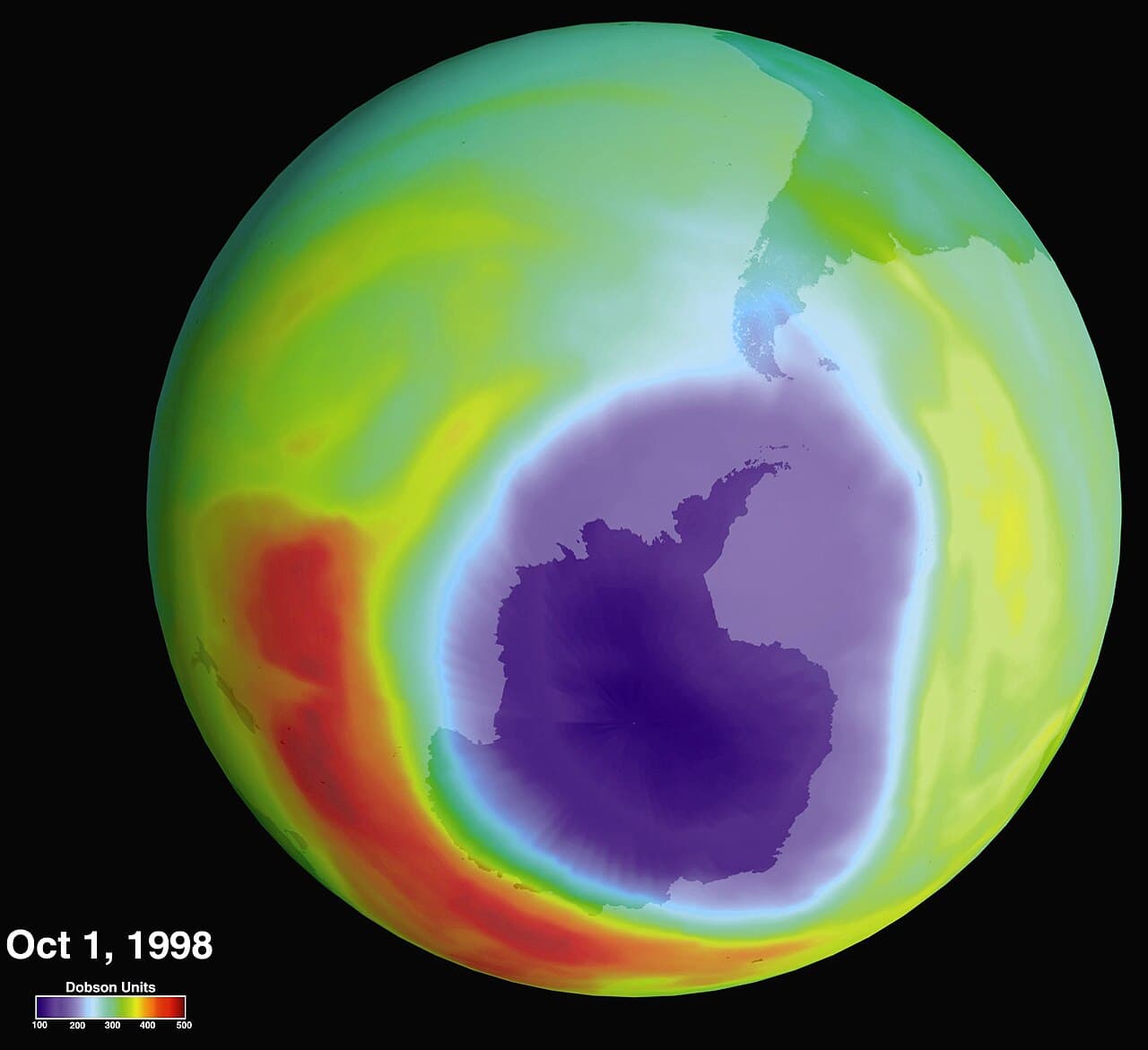 A NASA image showing the ozone hole over Antarctica as a large purple and blue region of depleted ozone.