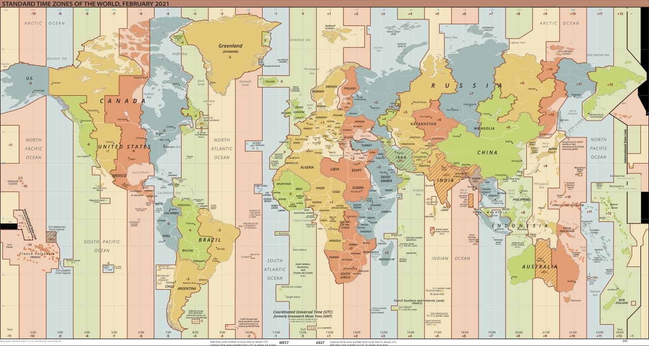 World map of standard time zones in coloured vertical bands with jagged borders that follow national boundaries.