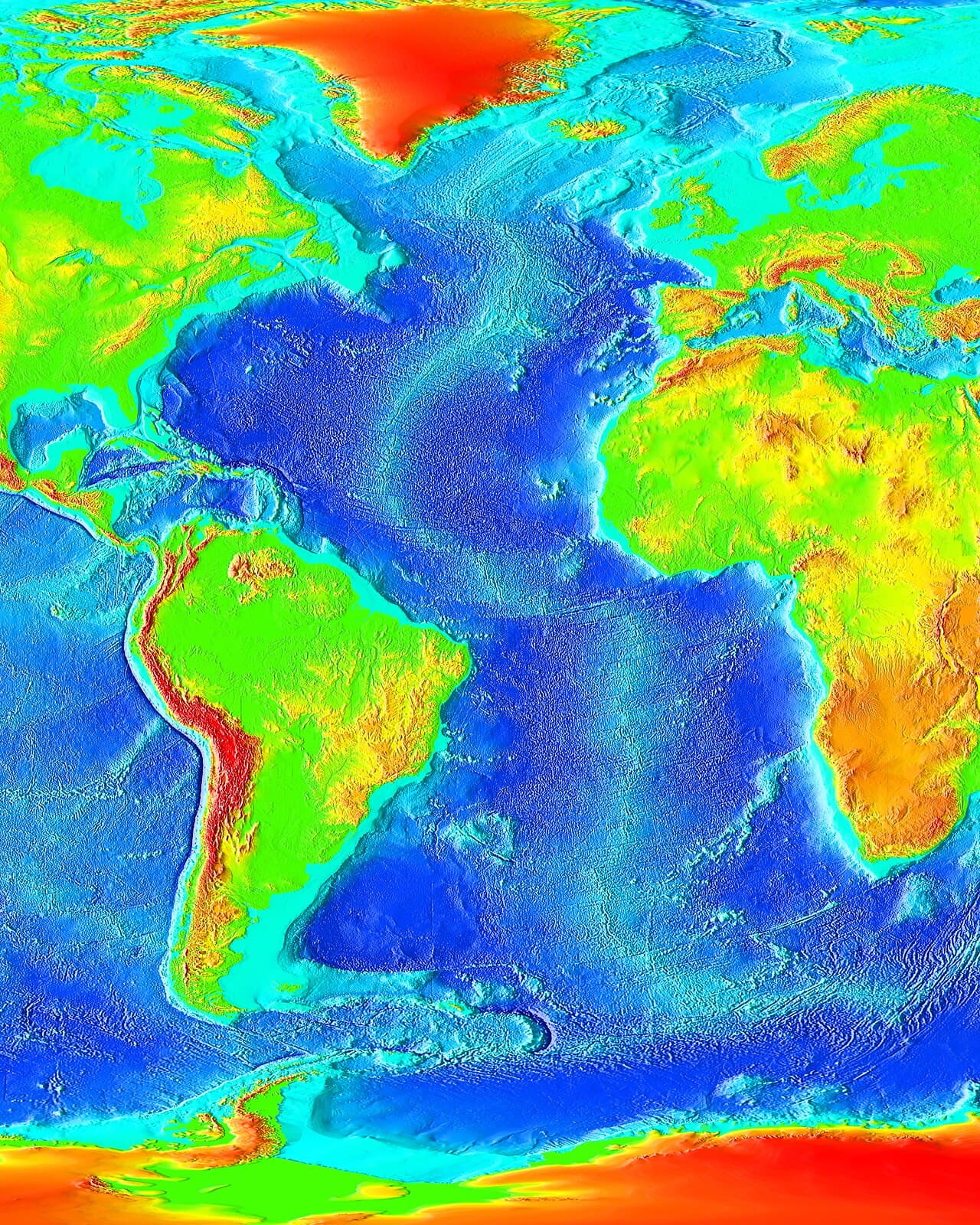 Map of the Atlantic Ocean floor coloured by depth, with a pale winding ridge running from north to south down the middle, between the Americas and Europe and Africa.