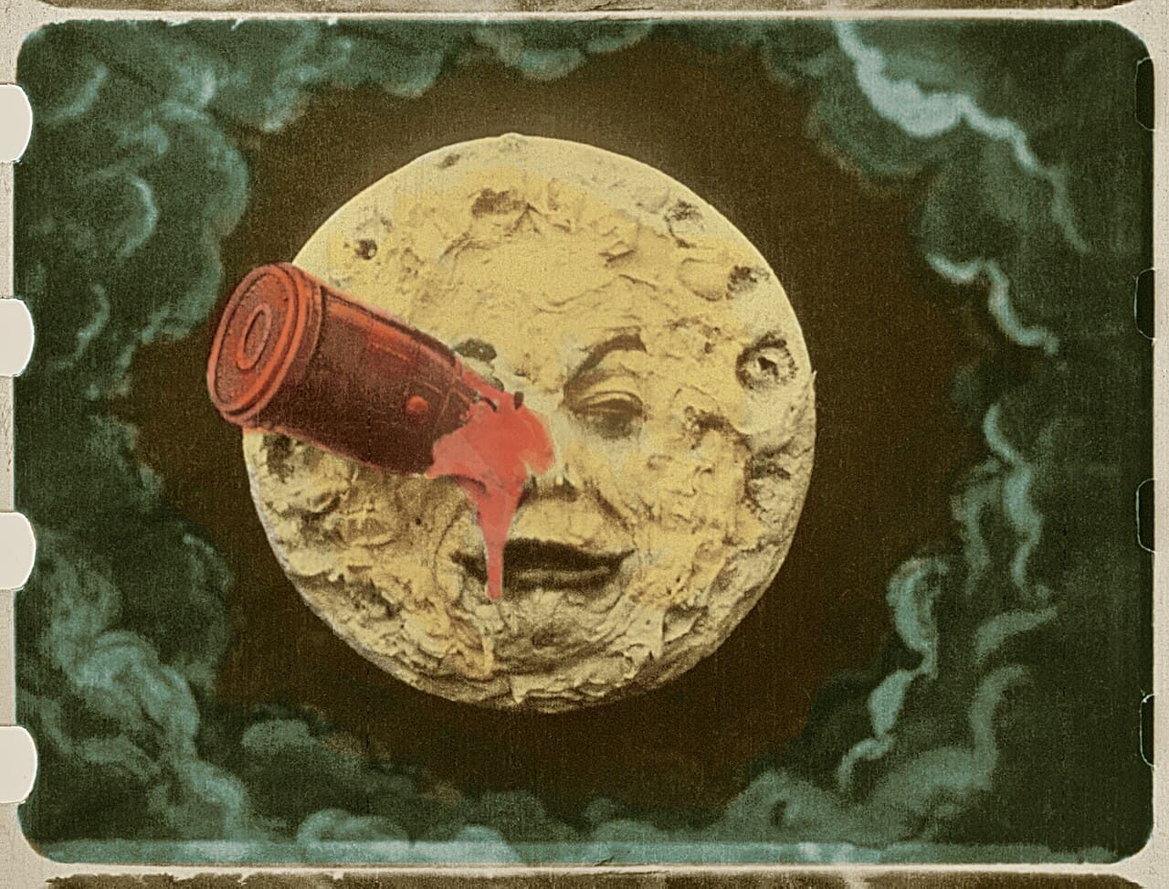 A frame from Méliès's A Trip to the Moon, with painted colours on the actors and the stage set.