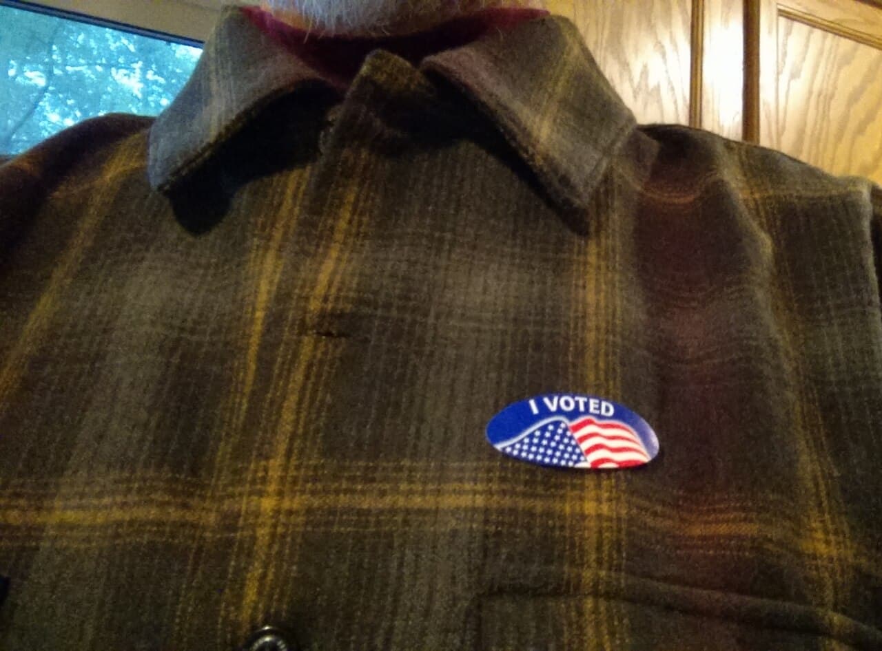 An 'I voted' sticker on a person's clothing.